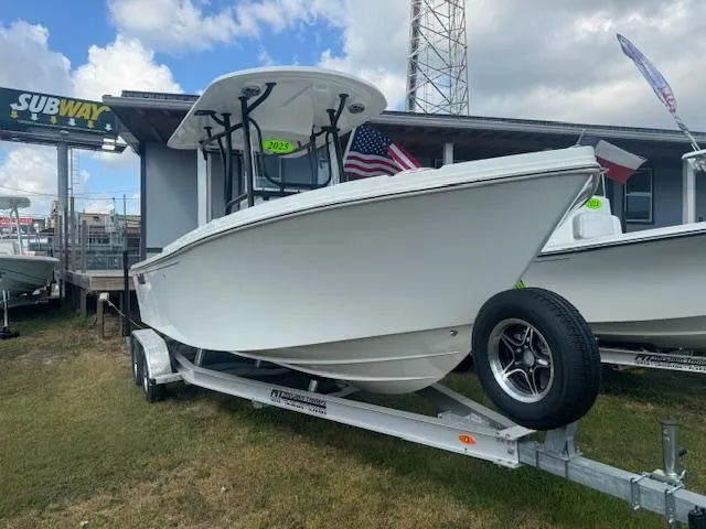 The Image of 2025 Parker 23SE Center Console boat on trailer, displayed outdoors. - 0