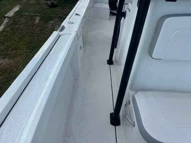 Slide: The Image of 2025 Parker 23SE Center Console boat interior with white seating and deck. - 12