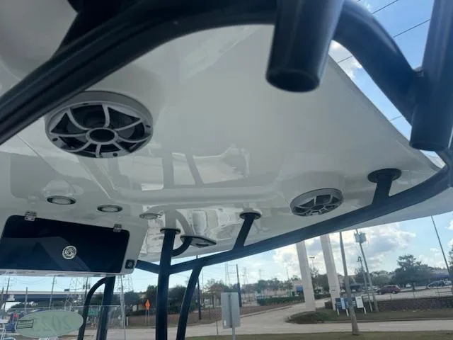 Slide: The Image of 2025 Parker 23SE Center Console boat with speakers and lights on the canopy. - 13