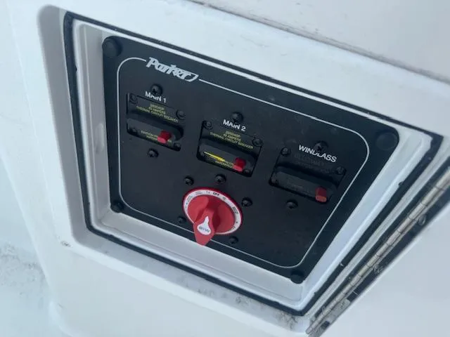 Slide: The Image of Control panel of 2025 Parker 23SE Center Console boat with switches and dial. - 17