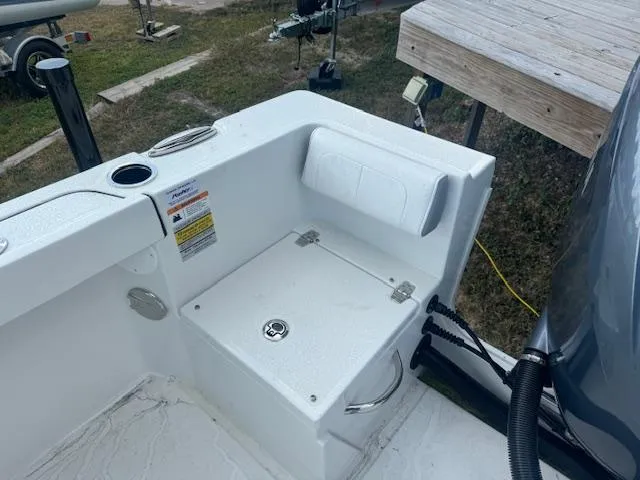 Slide: The Image of 2025 Parker 23SE Center Console boat interior with storage compartment and seating. - 18