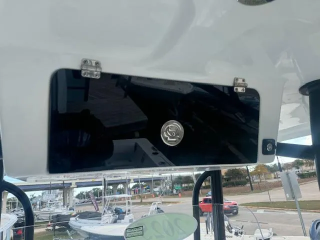 Slide: The Image of 2025 Parker 23SE Center Console boat dashboard with storage compartment. - 14