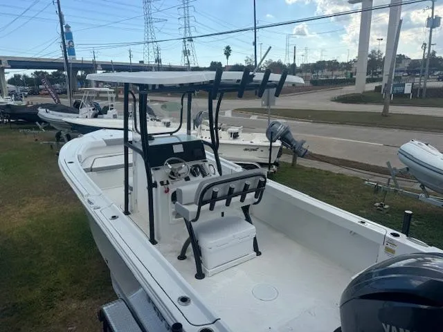 Slide: The Image of 2025 Parker 23SE Center Console boat with Yamaha engine, docked outdoors. - 6