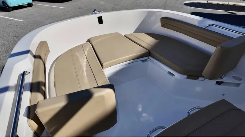 Slide: The Image of 2025 Bayliner Trophy 22 CC boat interior with beige seating. - 13
