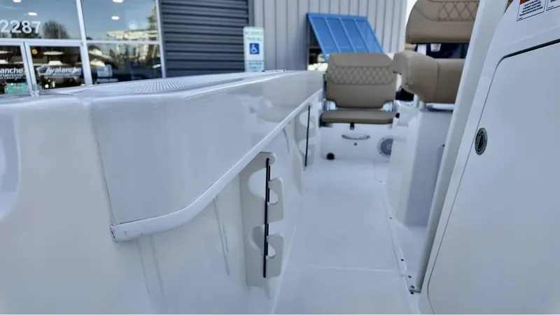 Slide: The Image of 2025 Bayliner Trophy 22 CC boat interior with seating and storage features. - 17
