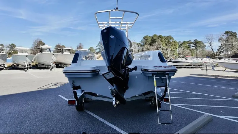 Slide: The Image of 2025 Bayliner Trophy 22 CC boat on trailer in parking lot. - 2