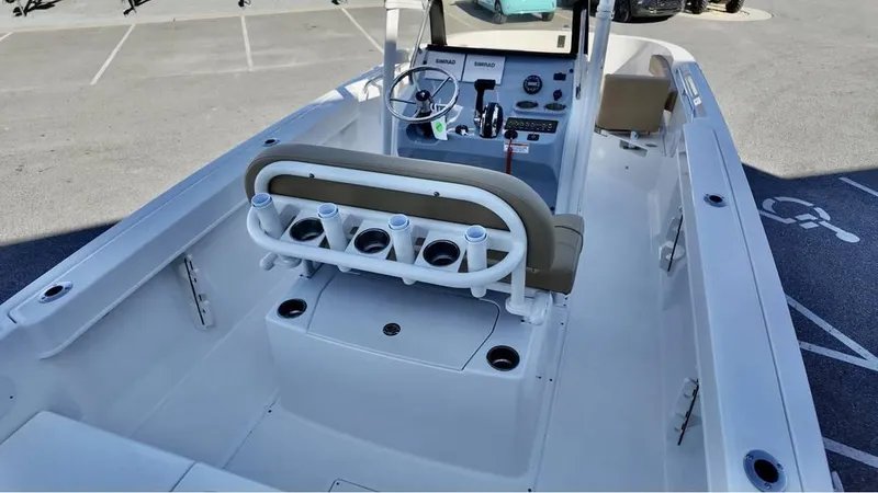 Slide: The Image of 2025 Bayliner Trophy 22 CC boat interior with seating and steering console. - 6