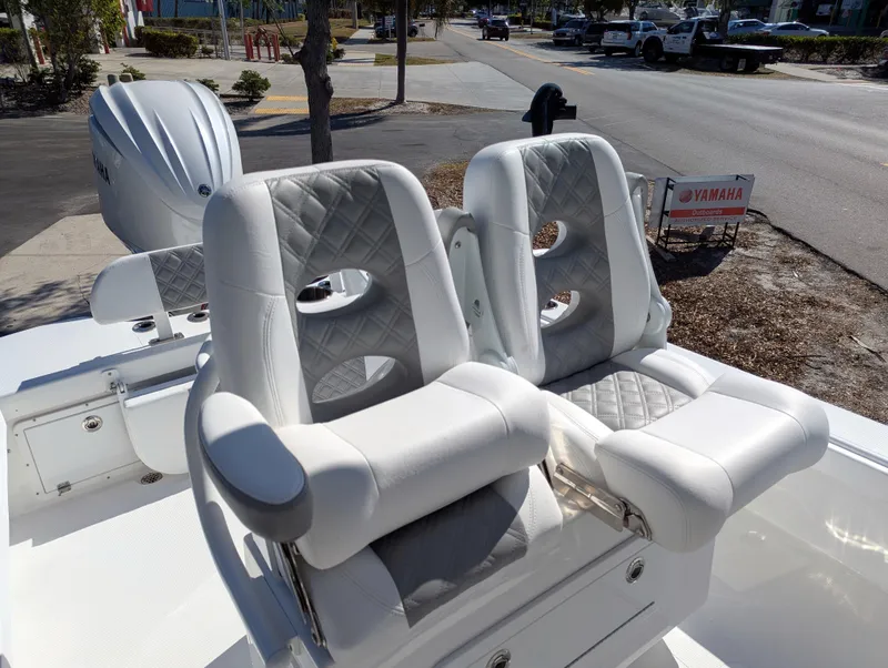 Slide: The Image of Luxury seating on 2025 BlackJack 256 Coastal boat with Yamaha engine in background. - 10