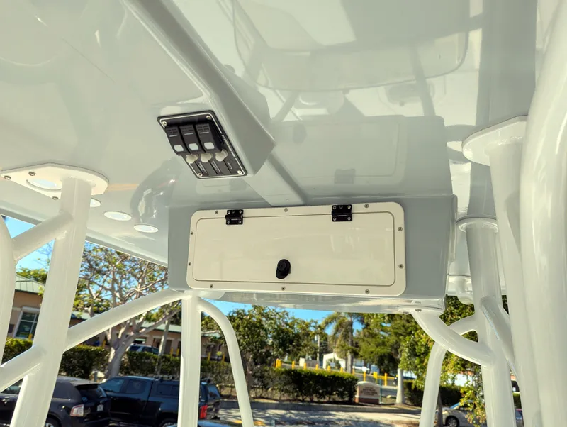 Slide: The Image of 2025 BlackJack 256 Coastal boat console with storage compartment and control panel. - 12