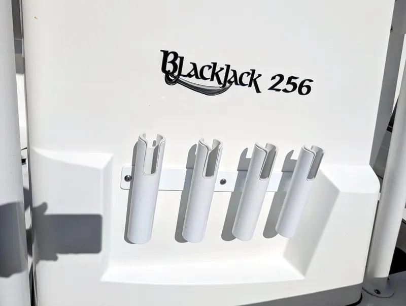 Slide: The Image of BlackJack 256 Coastal 2025 boat detail with rod holders. - 16