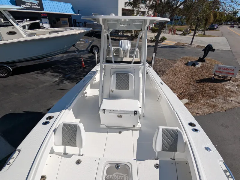 Slide: The Image of 2025 BlackJack 256 Coastal boat, white interior, center console, outdoor display. - 20