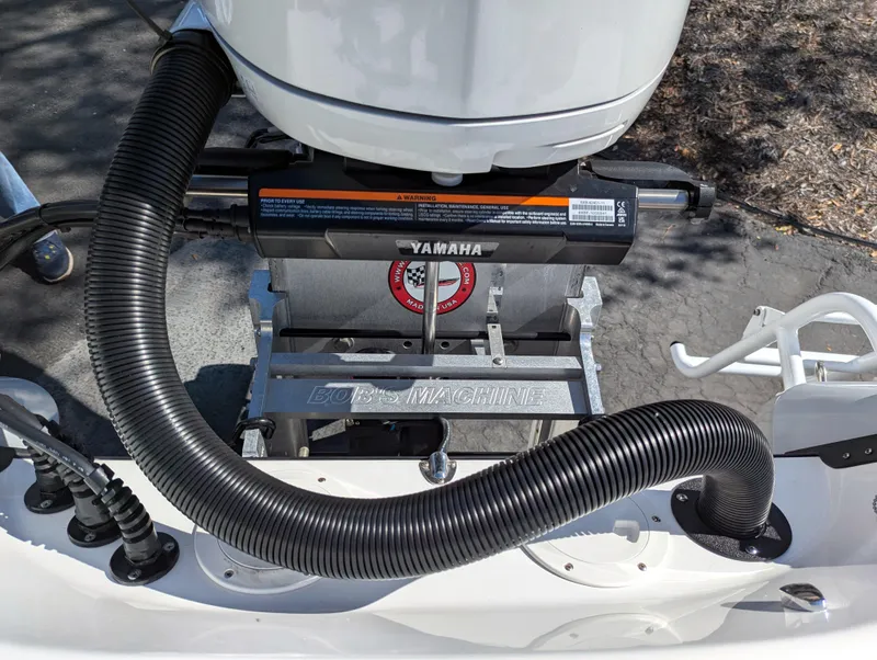 Slide: The Image of Close-up of a 2025 BlackJack 256 Coastal boat engine with Yamaha components. - 28
