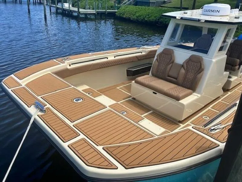 Slide: The Image of 2025 BlueCat boat with teak deck, luxurious seating, and modern design. - 4