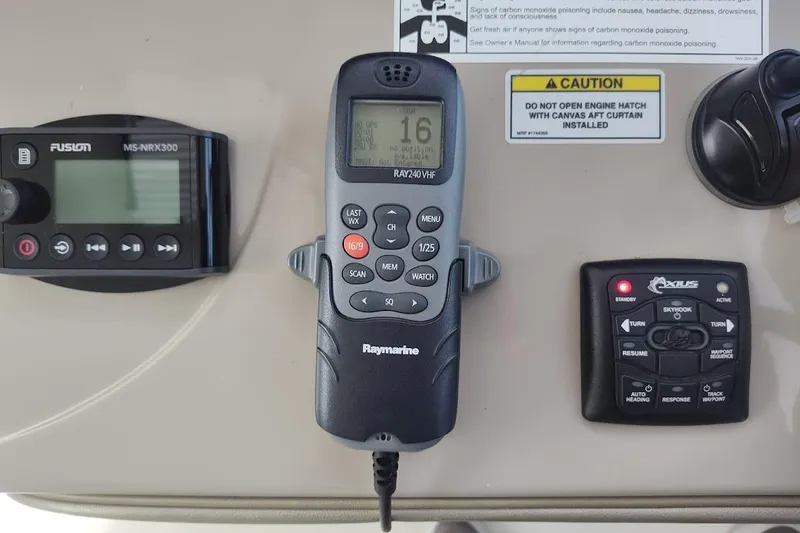 Slide: The Image of Control panel of a 2009 Sea Ray 390 Sundancer with Raymarine and Fusion devices. - 16