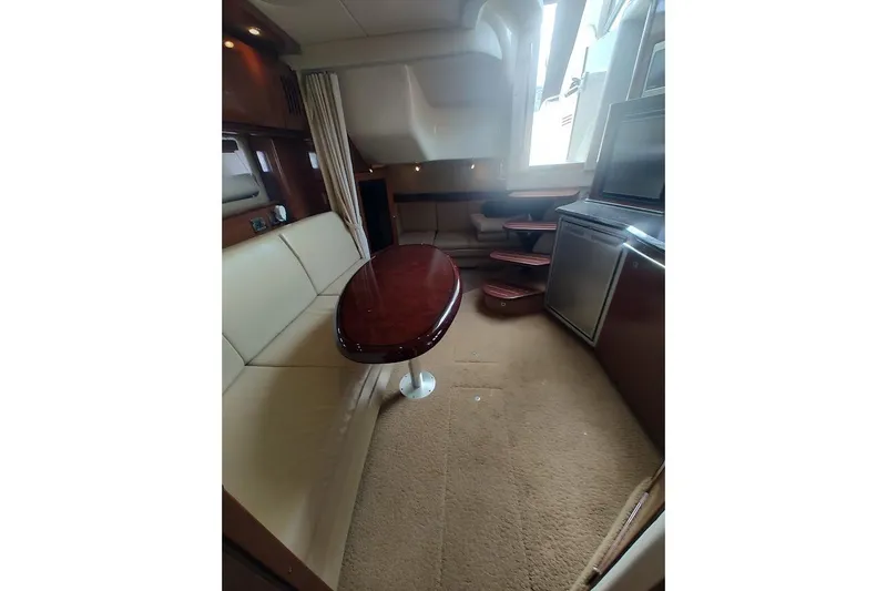 Slide: The Image of Luxurious interior of 2009 Sea Ray 380 Sundancer yacht with elegant seating and table. - 28