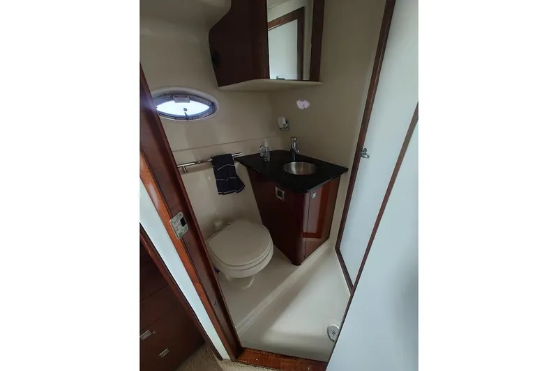 Slide: The Image of Bathroom interior of 2009 Sea Ray 380 Sundancer yacht with sink and toilet. - 30