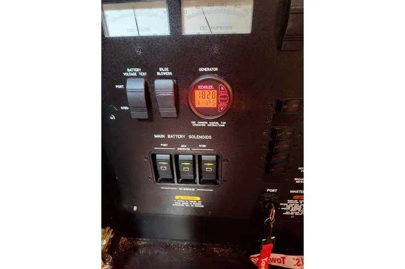 Slide: The Image of Engine room of 2009 Sea Ray 390 Sundancer with visible engine components. - 34