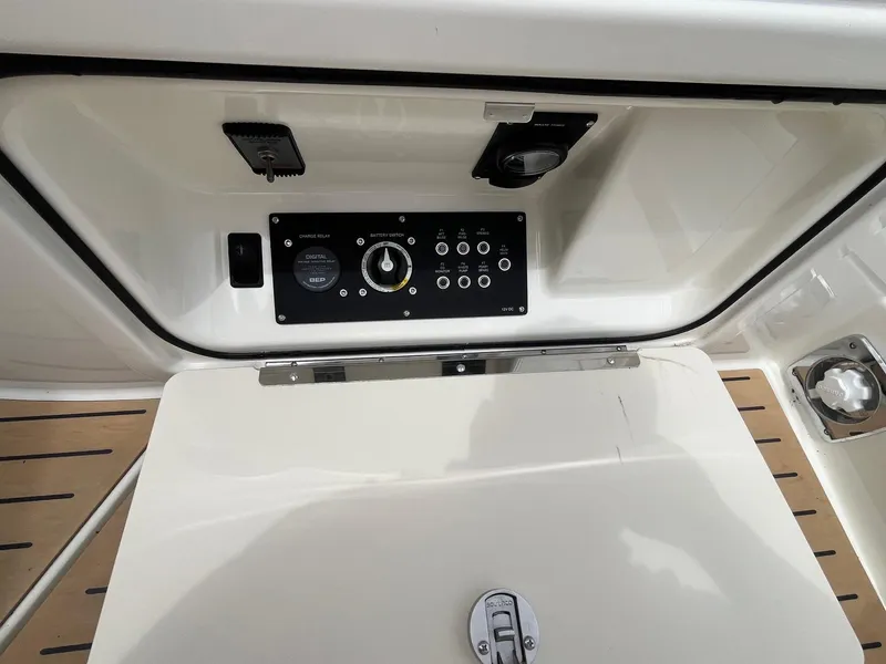 Slide: The Image of Control panel of 2025 Bayliner Trophy T25 Explorer boat, featuring switches and dials. - 8