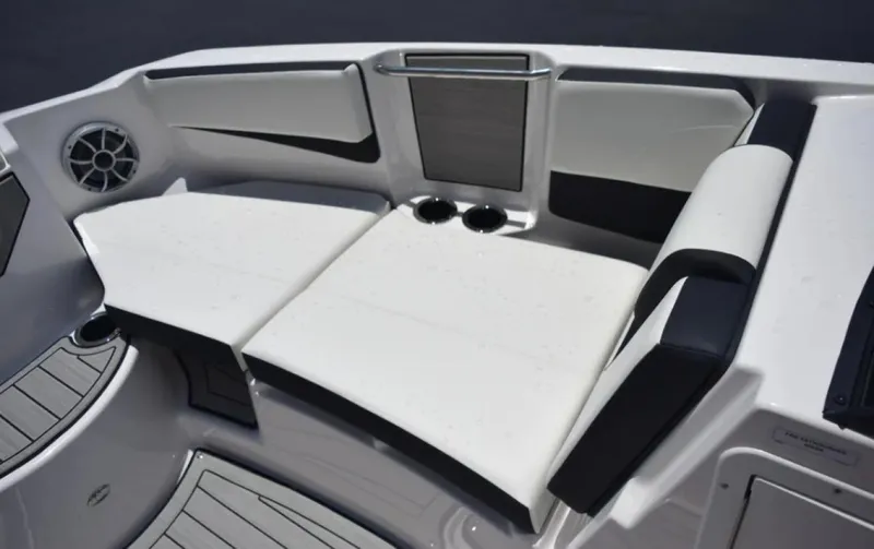 Slide: The Image of 2024 Yamaha Boats 222SD interior seating with cup holders and sleek design. - 5