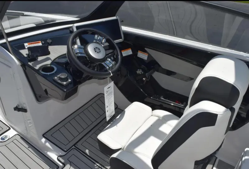 Slide: The Image of 2024 Yamaha Boats 222SD cockpit with modern steering and seating. - 7