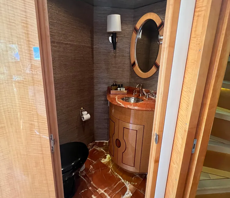 Slide: The Image of Luxurious bathroom on 2004 Hatteras 80 Motor Yacht with elegant wood and marble finishes. - 17