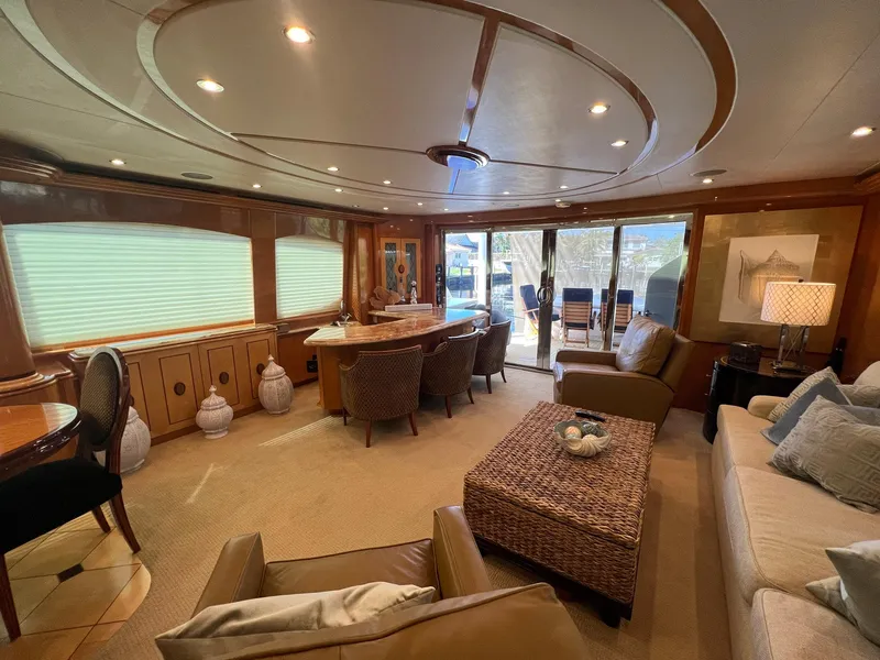 Slide: The Image of Luxurious interior of 2004 Hatteras 80 Motor Yacht with elegant seating and decor. - 2
