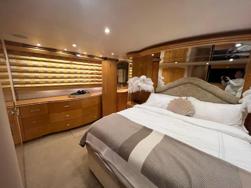 Slide: The Image of Luxurious bedroom interior of 2004 Hatteras 80 Motor Yacht with elegant decor. - 23
