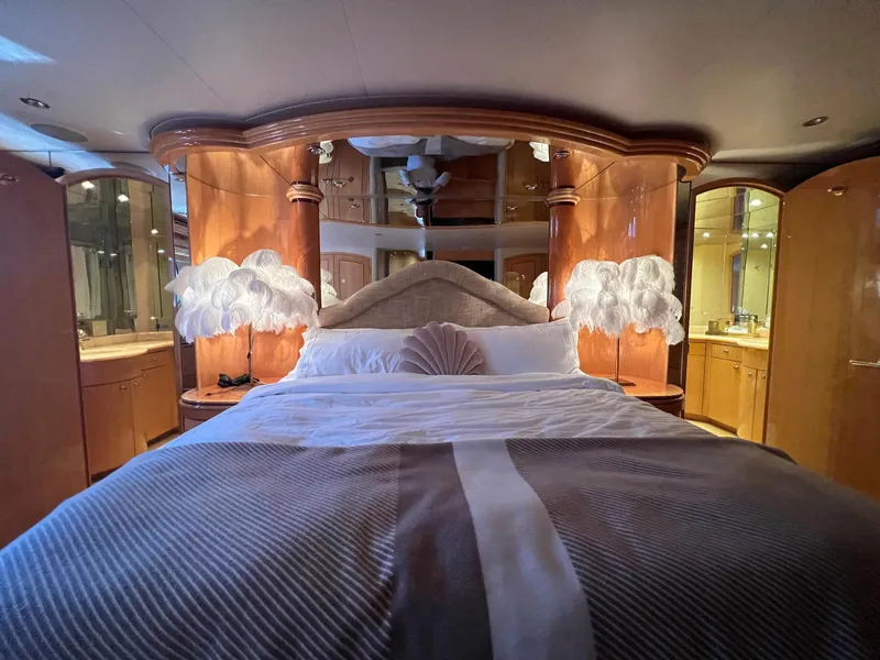 Slide: The Image of Luxurious bedroom interior of 2004 Hatteras 80 Motor Yacht with elegant wood finishes. - 26