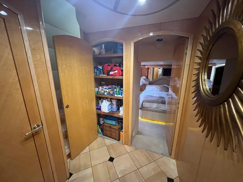 Slide: The Image of Interior of 2004 Hatteras 80 Motor Yacht with open pantry and bedroom view. - 29