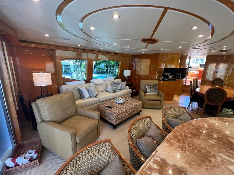 Slide: The Image of Luxurious interior of 2004 Hatteras 80 Motor Yacht with elegant seating and decor. - 3