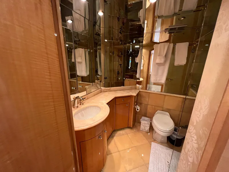 Slide: The Image of Luxurious bathroom in 2004 Hatteras 80 Motor Yacht with wood cabinetry and elegant fixtures. - 34