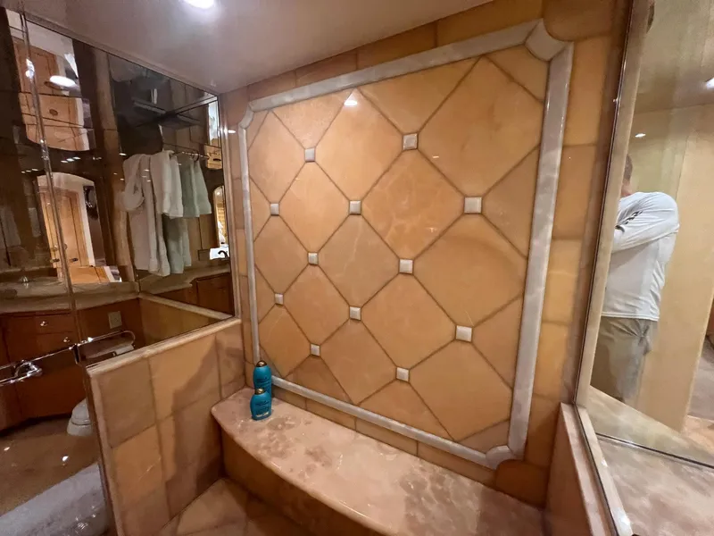 Slide: The Image of Luxurious bathroom interior of 2004 Hatteras 80 Motor Yacht with elegant tile design. - 35