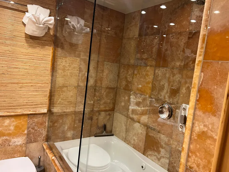 Slide: The Image of Luxurious bathroom with marble tiles in 2004 Hatteras 80 Motor Yacht. - 39