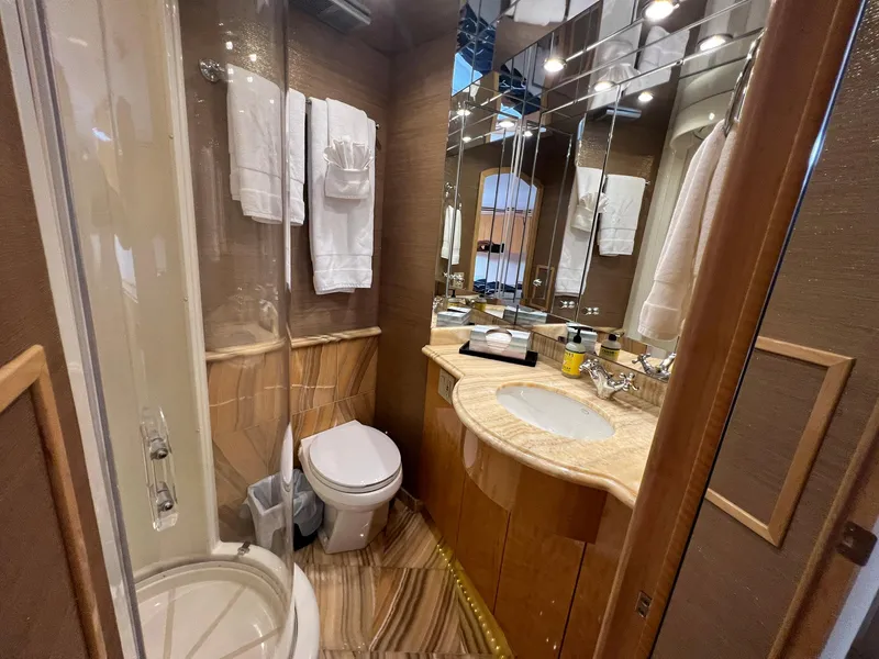 Slide: The Image of Luxurious bathroom in 2004 Hatteras 80 Motor Yacht with elegant fixtures and mirrored walls. - 43