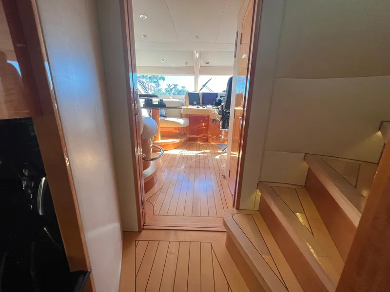 Slide: The Image of Interior view of 2004 Hatteras 80 Motor Yacht with wooden flooring and stairs. - 47