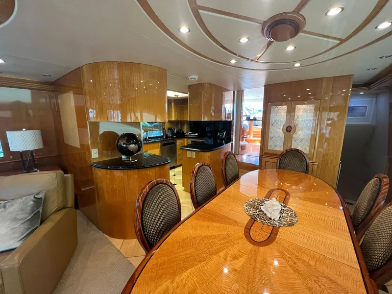 Slide: The Image of Luxurious interior of 2004 Hatteras 80 Motor Yacht with elegant dining area and modern decor. - 9