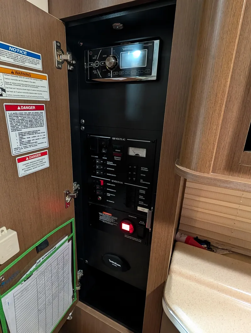 Slide: The Image of Control panel inside 2015 Sea Ray 280 Sundancer boat cabin. - 18