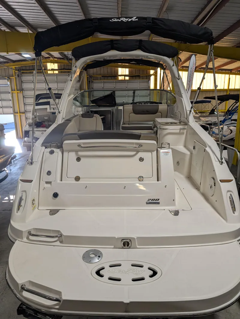 Slide: The Image of 2015 Sea Ray 280 Sundancer boat in storage, rear view. - 2