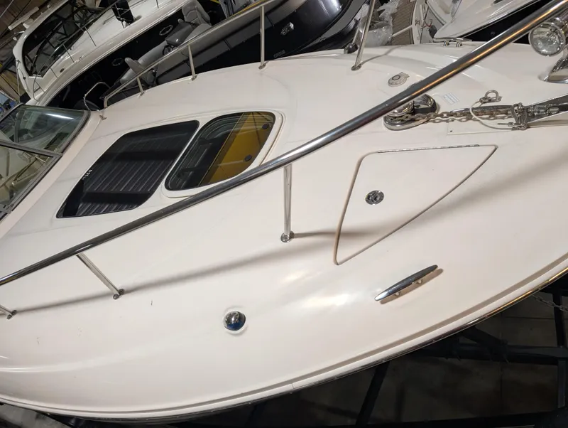 Slide: The Image of 2015 Sea Ray 280 Sundancer boat deck with railing and hatch. - 33