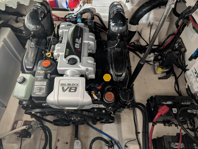 Slide: The Image of 2015 Sea Ray 280 Sundancer engine compartment with Big Block V8 engine. - 35