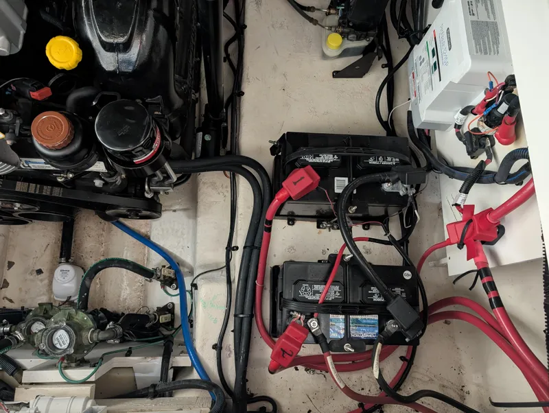 Slide: The Image of Engine compartment of 2015 Sea Ray 280 Sundancer with batteries and wiring. - 36
