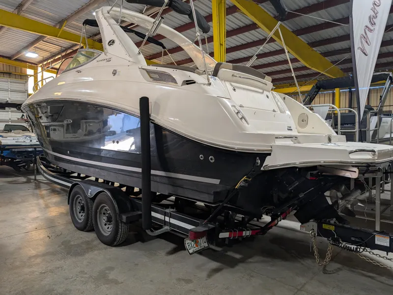 Slide: The Image of 2015 Sea Ray 280 Sundancer boat on trailer in indoor storage facility. - 42