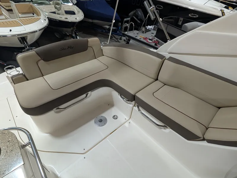 Slide: The Image of 2015 Sea Ray 280 Sundancer boat interior with beige seating arrangement. - 5