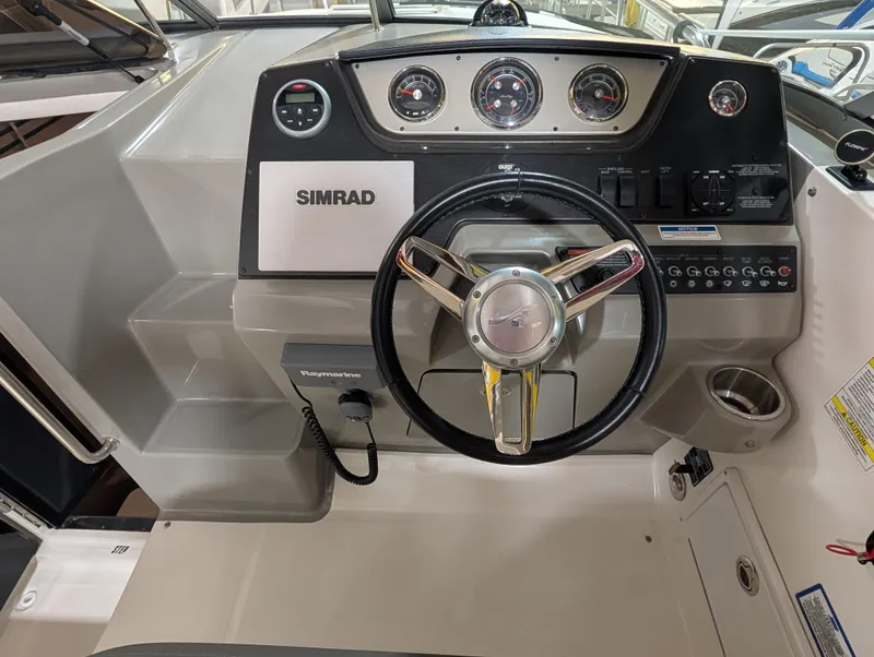 Slide: The Image of 2015 Sea Ray 280 Sundancer helm with Simrad navigation system and gauges. - 7