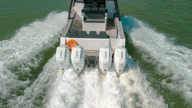 Slide: The Image of 2025 Sedna 370 Side Console boat with four powerful engines on water. - 14