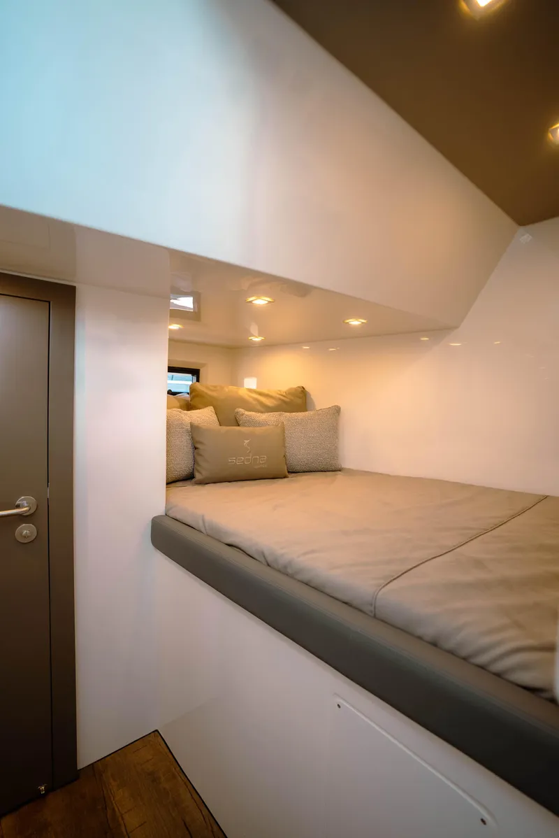 Slide: The Image of Interior cabin of 2025 Sedna 370 Side Console with cozy bedding. - 15