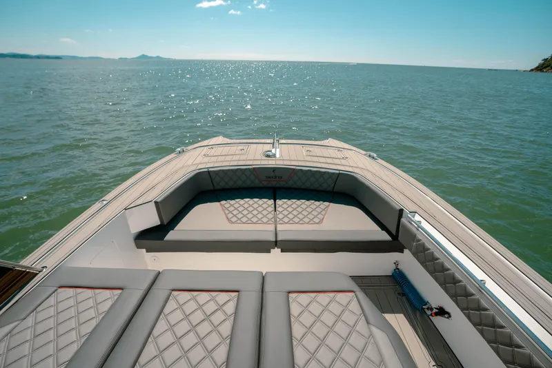 Slide: The Image of Sedna 370 Side Console 2025 boat on calm sea with spacious seating. - 6
