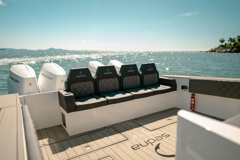 Slide: The Image of Sedna 370 Side Console 2025 boat with Mercury engines on a sunny day at sea. - 7
