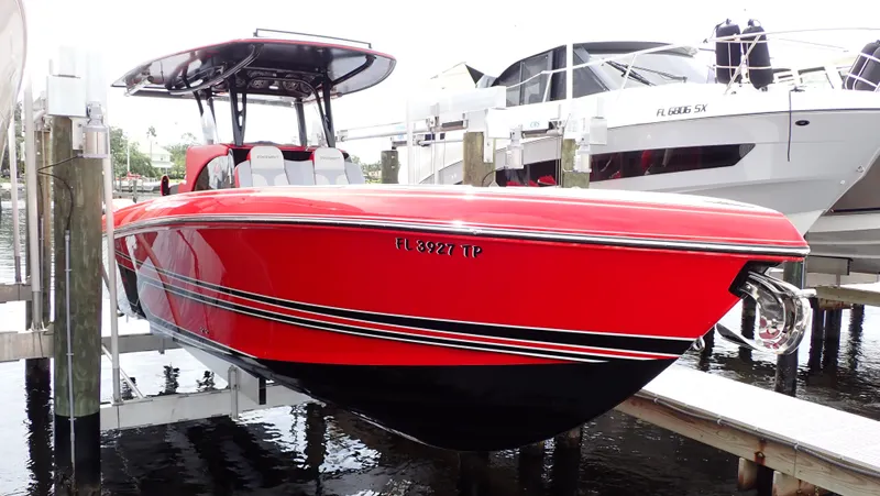 Slide: The Image of Red 2024 Statement 350 Open boat docked, featuring sleek design and modern amenities. - 2