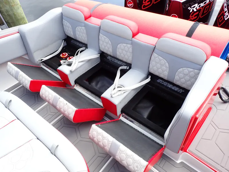 Slide: The Image of 2024 Statement 350 Open boat seating with storage compartments and red accents. - 27